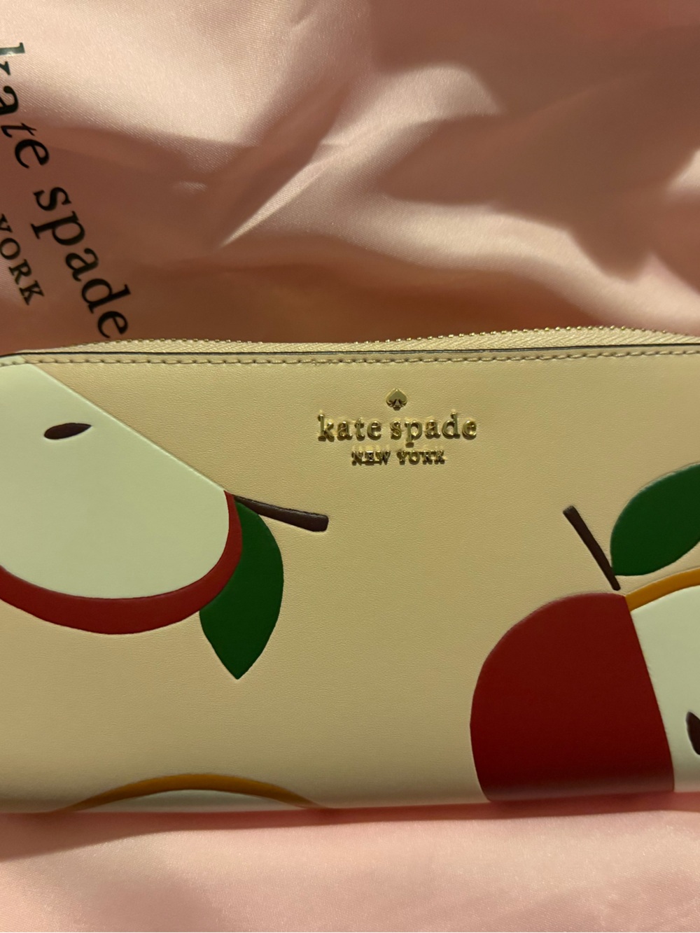 kate spade cream wallet with red apple print